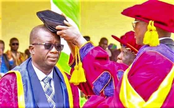 Naa Prof John Sulemana Nabila (middle), Chairman of the Governing Council of the DHLTU, inducting, Prof Elias Sowley into office